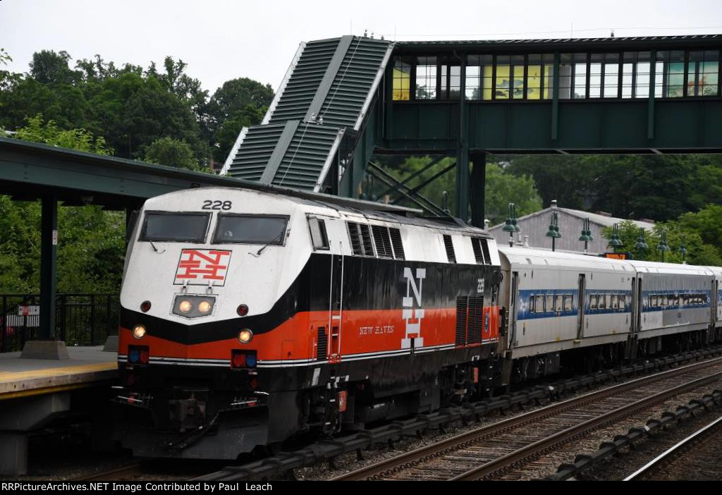 Outbound commuter approaches the station to makes its stop